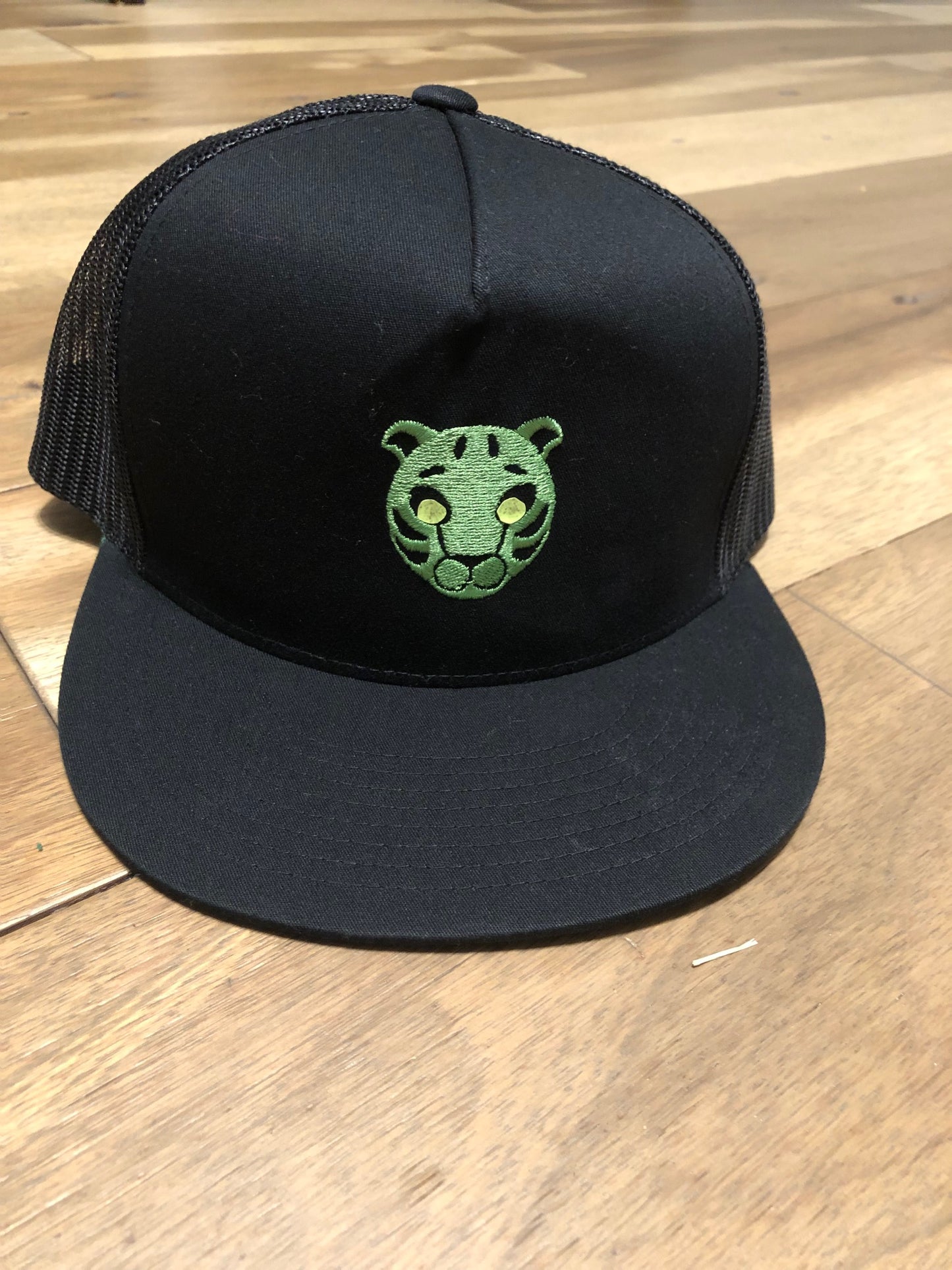 Green tiger embroidered black snap back hat or baseball cap